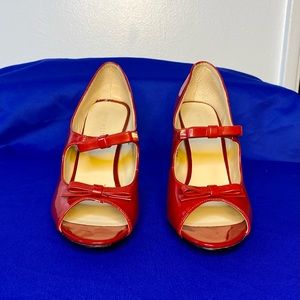 Nine West Brand woman’s open toe patent leather pumps. Size 8 1/2.